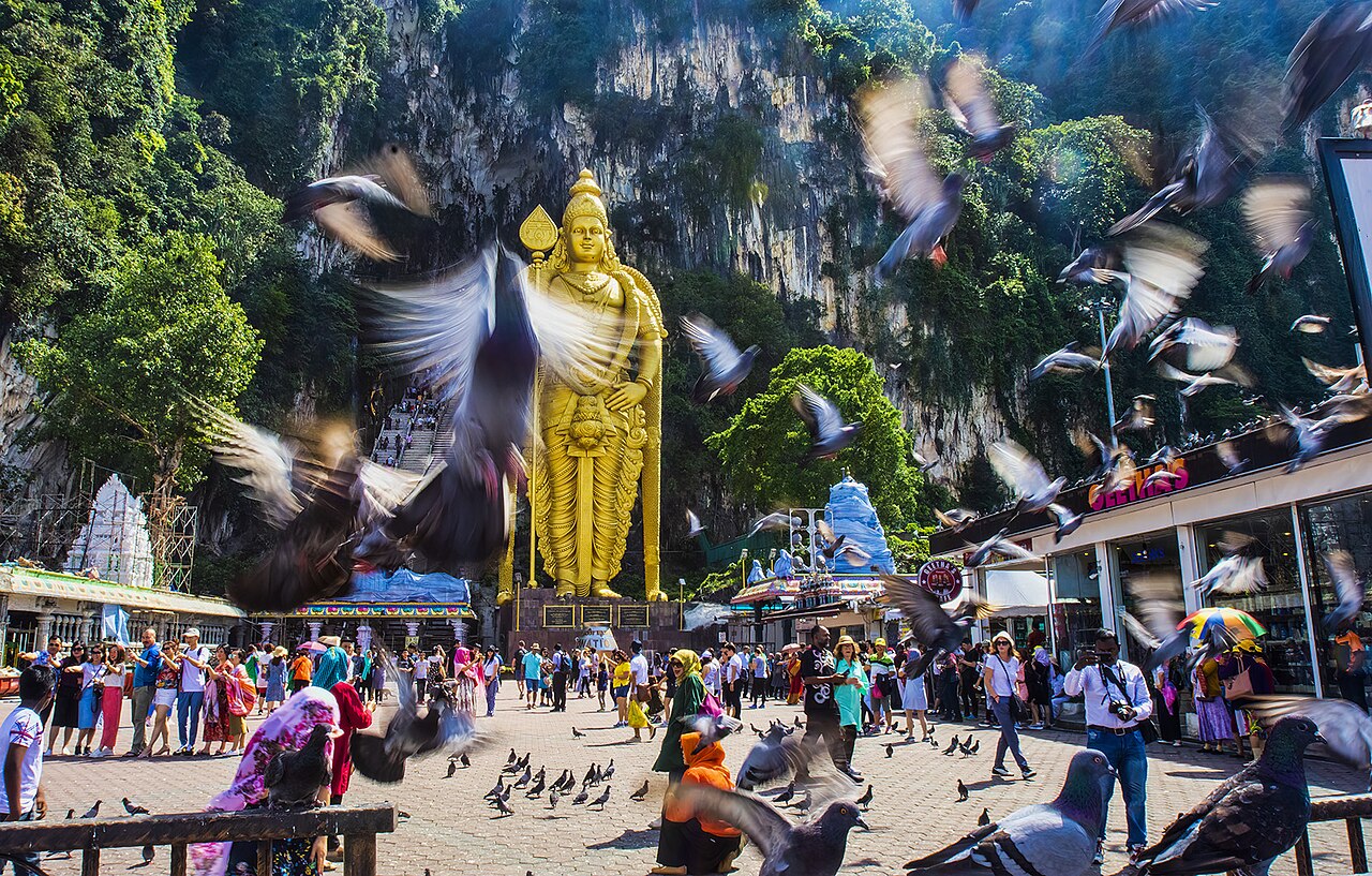 The golden Murugan statue and stairway at Batu Caves near Kuala Lumpur
