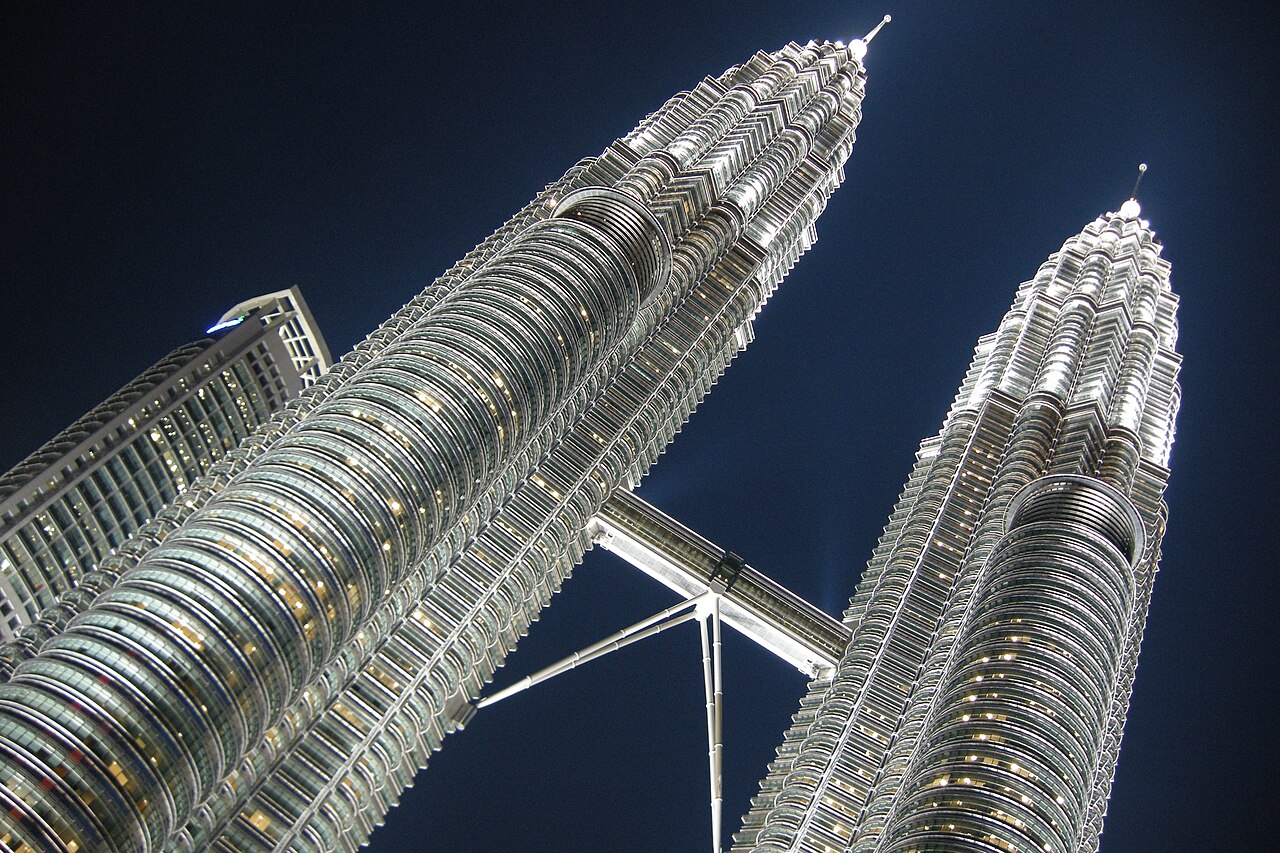 The Petronas Twin Towers lit up over Kuala Lumpur at night