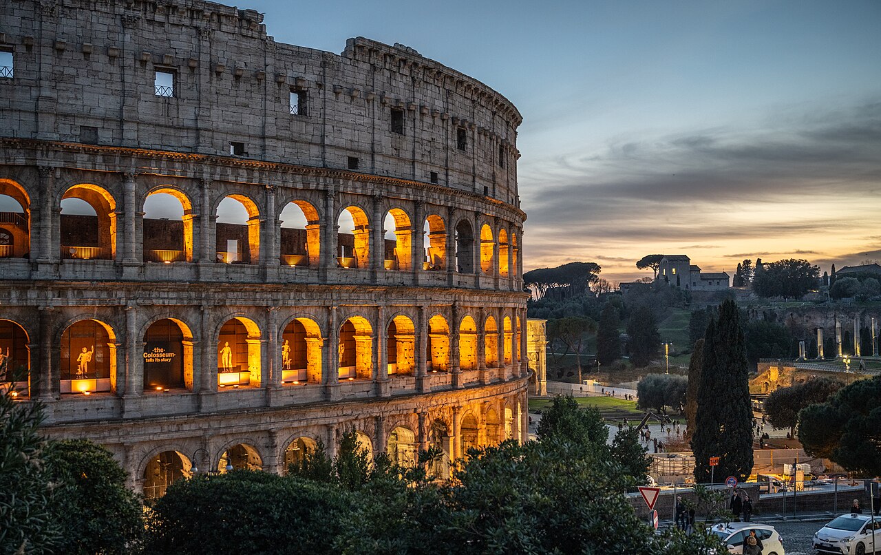 The Colosseum in Rome lit from within at dusk